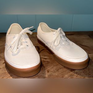 White and Tan Vans off the wall